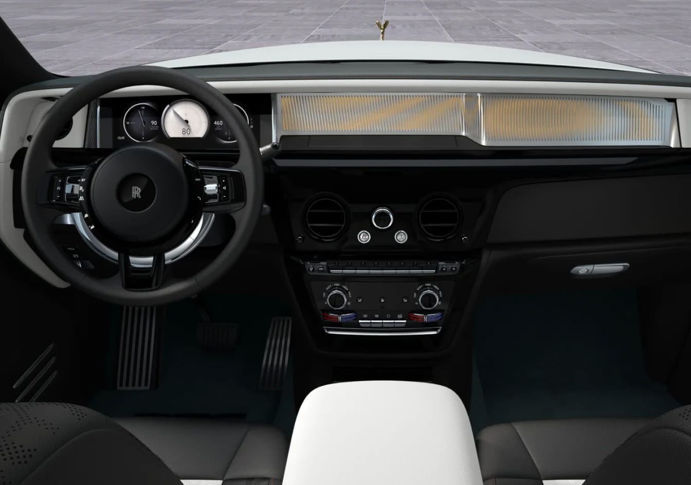 2026 Rolls-Royce Phantom interior showing a sleek, modern dashboard with a digital display, a stylish steering wheel, and premium materials. Gold-plated Spirit of Ecstasy shown.