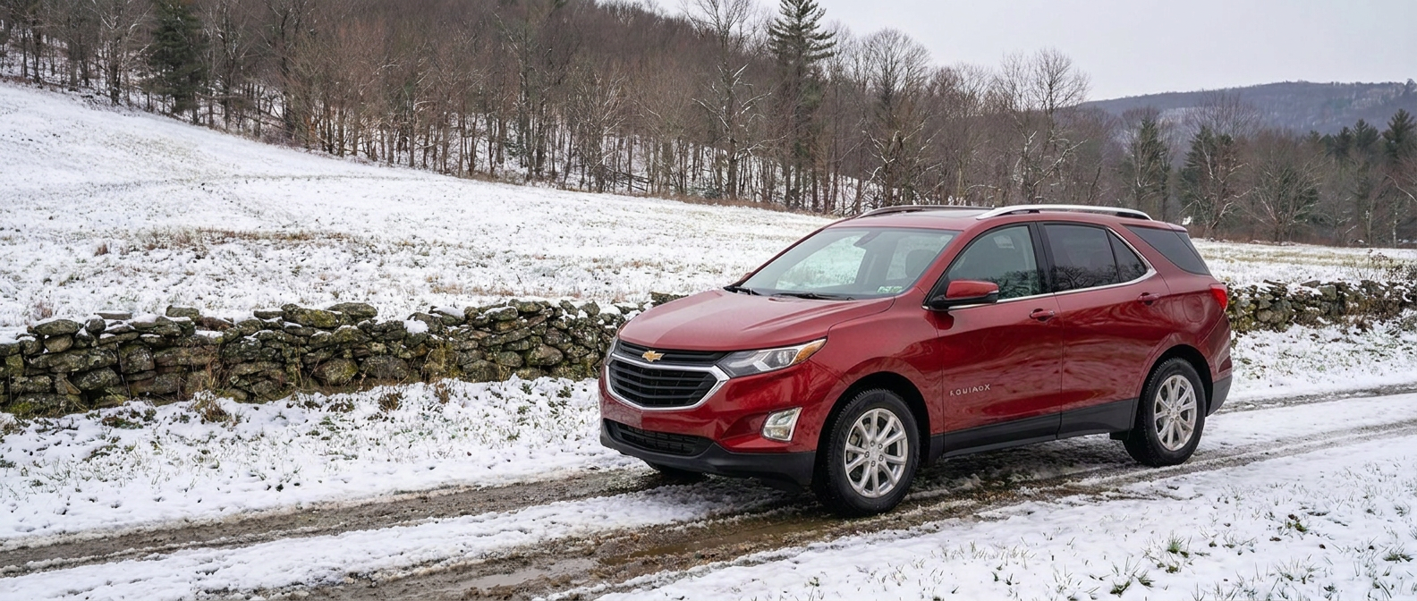 Chevrolet Equinox on a snowy Vermont road in fall with Three-Peak Mountain Snowflake rated tires