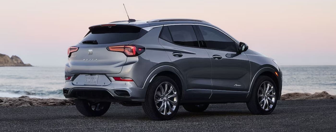 A silver 2026 Buick Encore GX parked near an ocean.