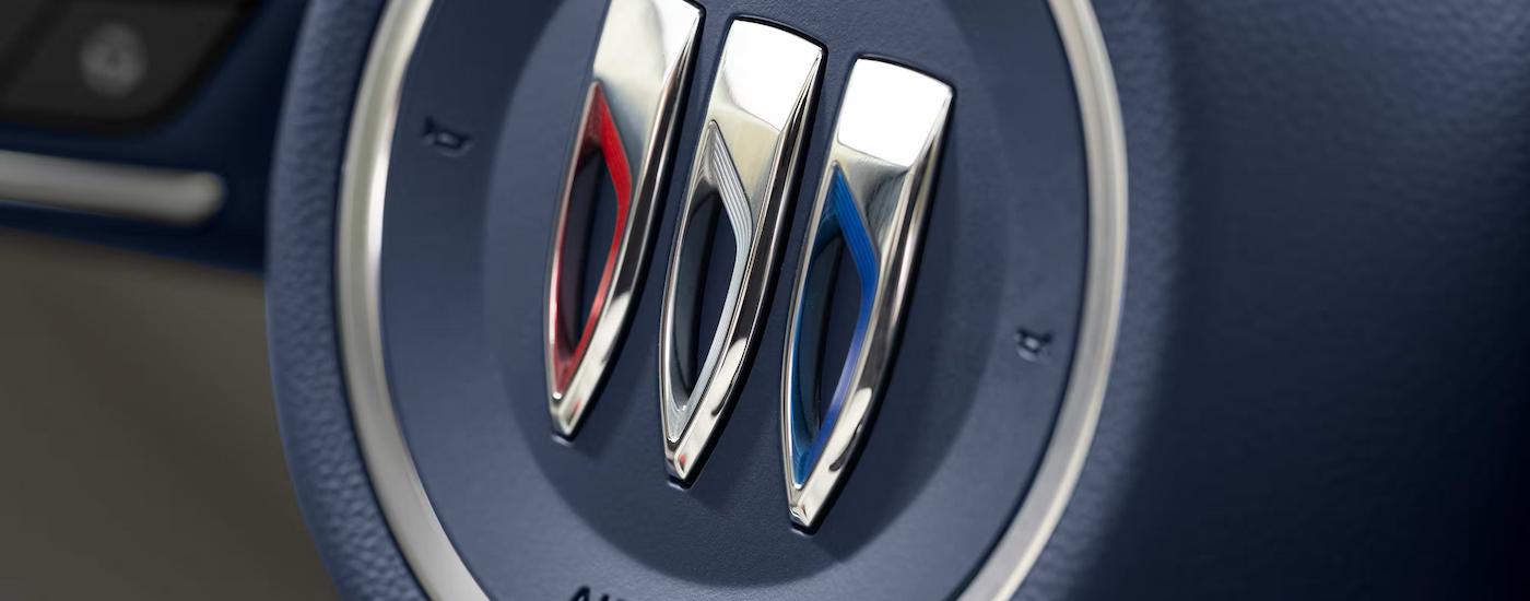 Buick badge on the steering wheel of a 2025 Buick Enclave.