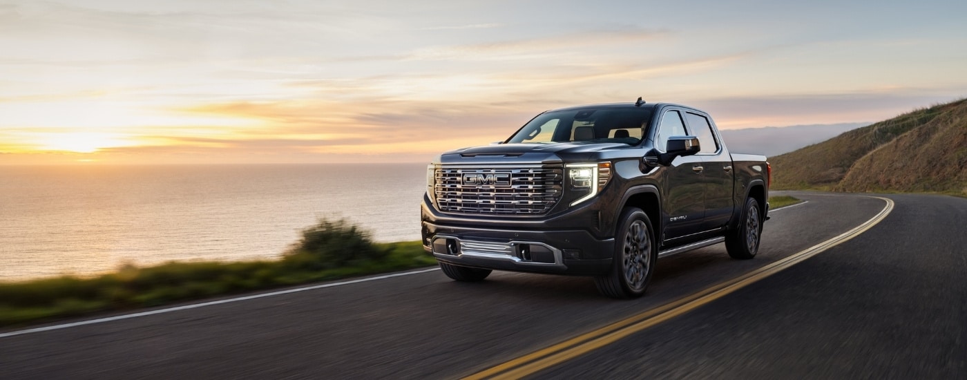 A grey 2025 GMC Sierra 1500 from the front at an angle.