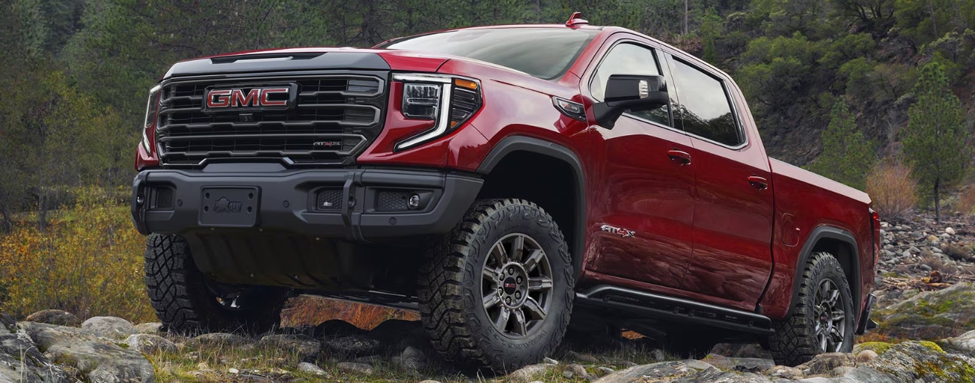Red 2026 GMC Sierra 1500 AT4 parked off-road