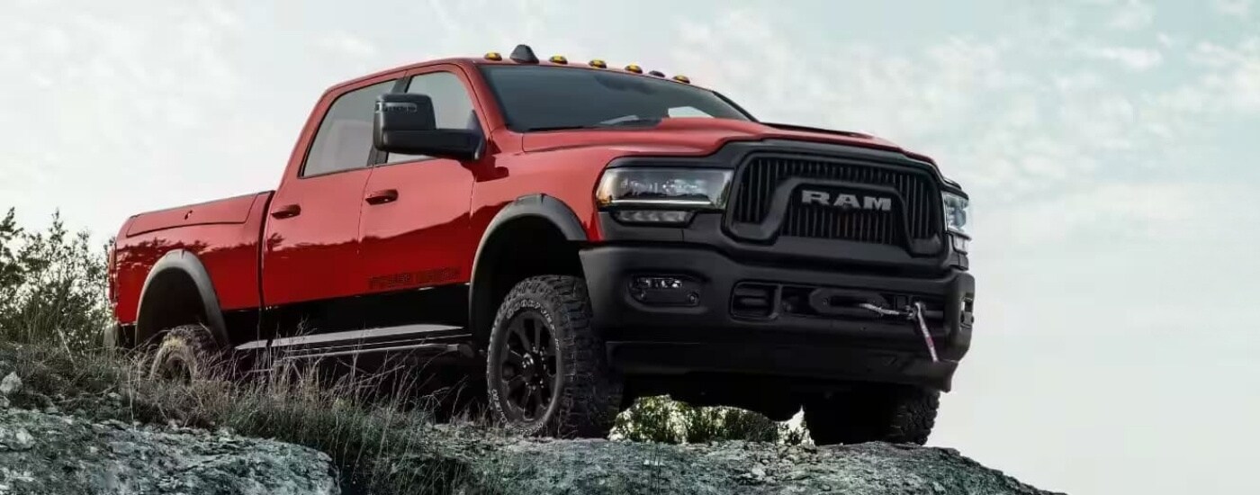 A red 2025 Ram 2500 parked off-road after leaving a Ram dealer near Hialeah.