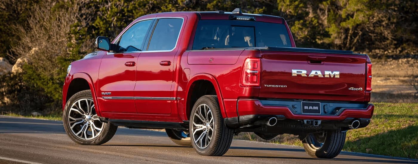 A red 2026 Ram 1500 parked on a sunny day.