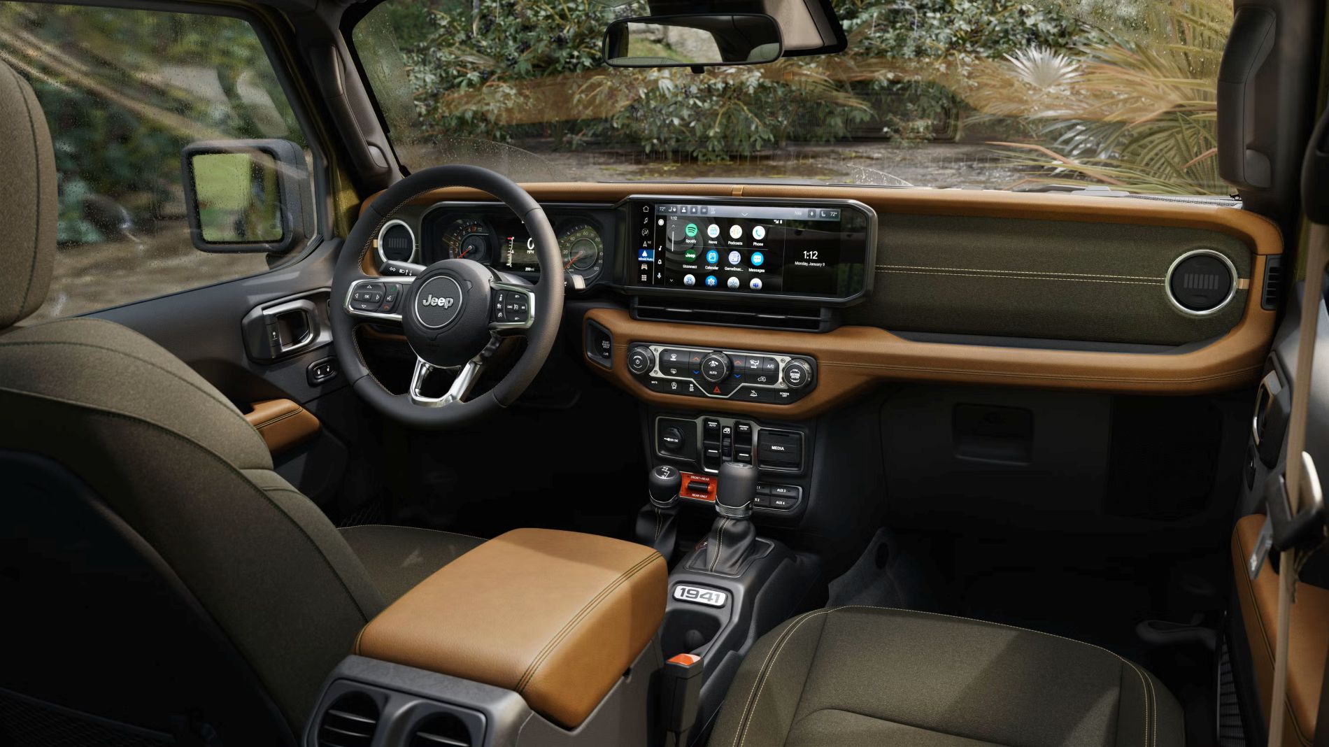 Jeep Wrangler dashboard with a digital instrument cluster, a wide touchscreen and brown leather trim