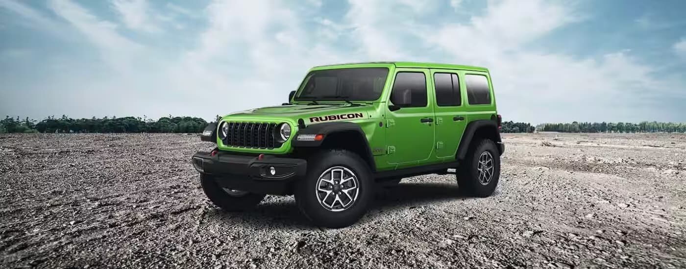 A green 2025 Jeep Wrangler parked after visiting a Jeep dealer near Pembroke Pines.