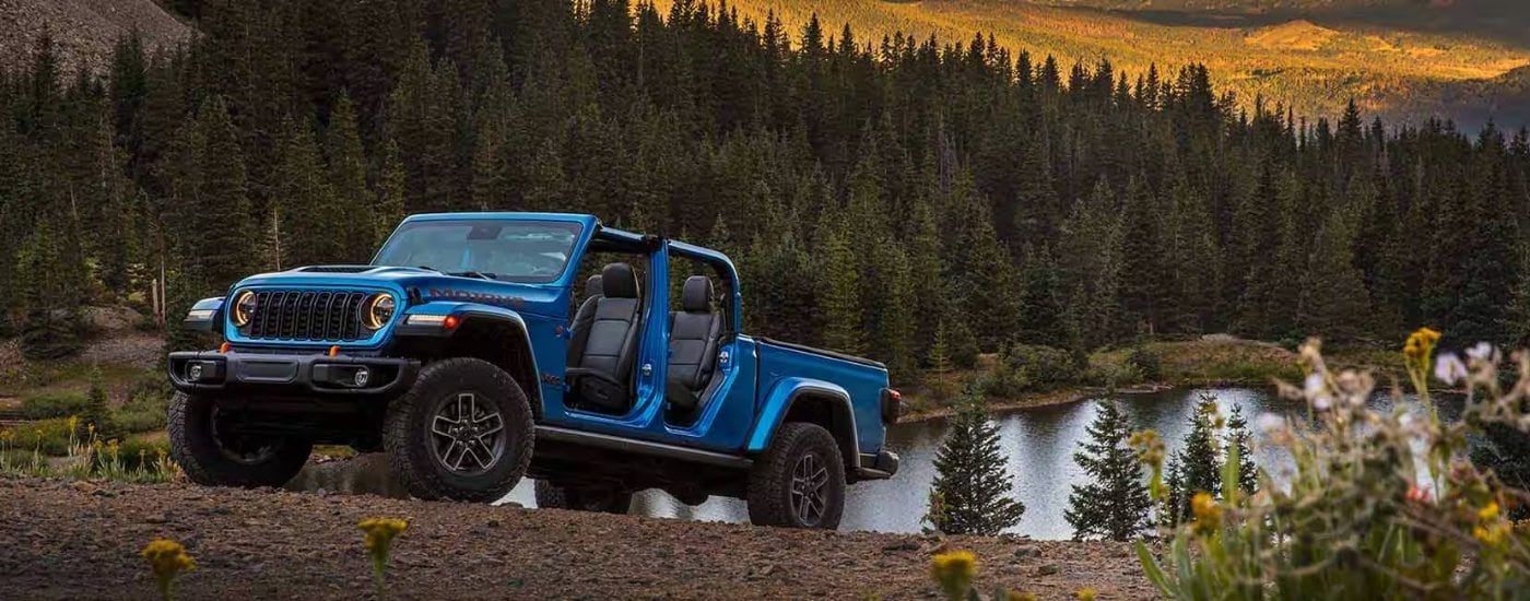 A blue 2025 Jeep Gladiator for sale from the side.