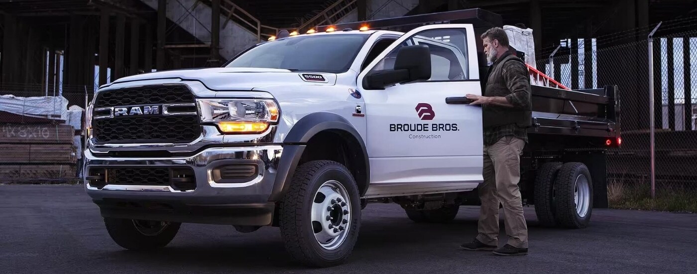 A white 2023 Ram 5500 Chassis Cab on a worksite after leaving a Ram dealer near Kendall.