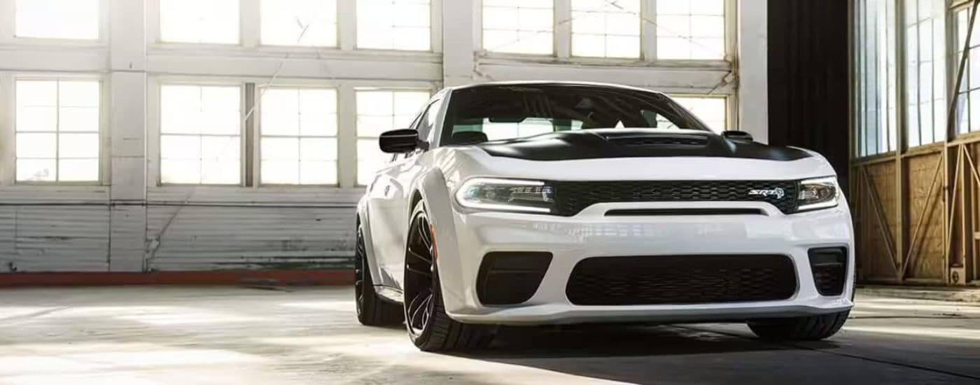 White 2023 Dodge Charger SRT parked in a garage