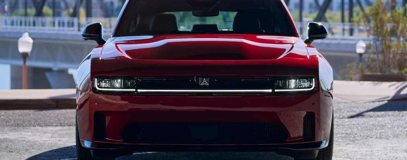 Front of a red 2025 Dodge Charger Daytona for sale in Miami at a dealership