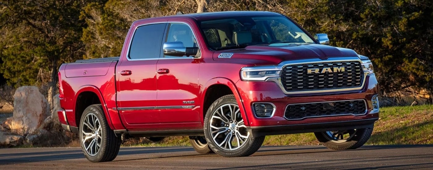 A red 2025 Ram 1500 from the front at an angle after leaving a Ram dealer near Fort Lauderdale.