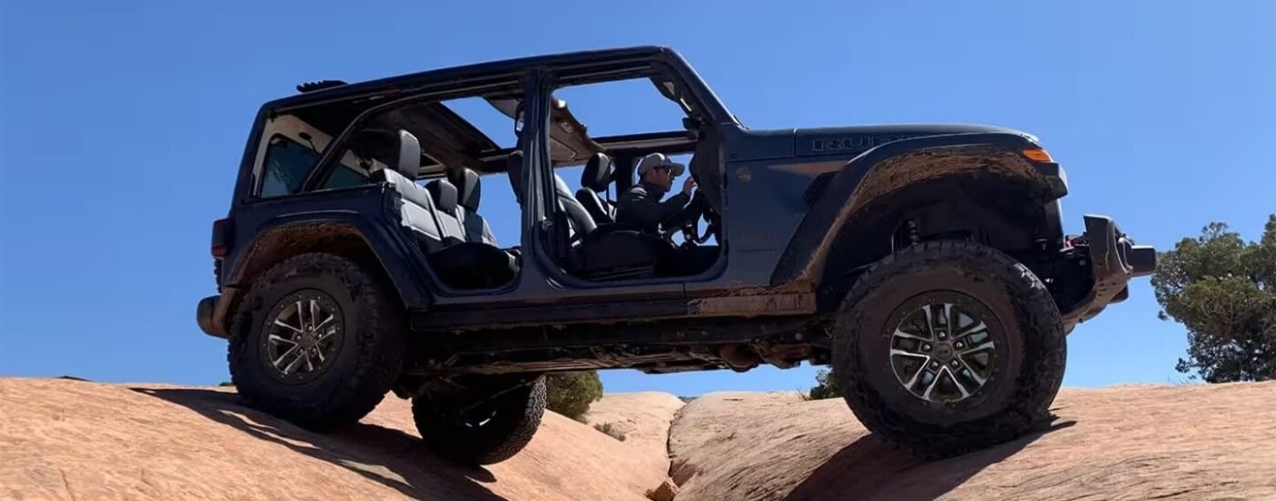 Grey 2024 Jeep Wrangler Unlimited Rubicon off-roading