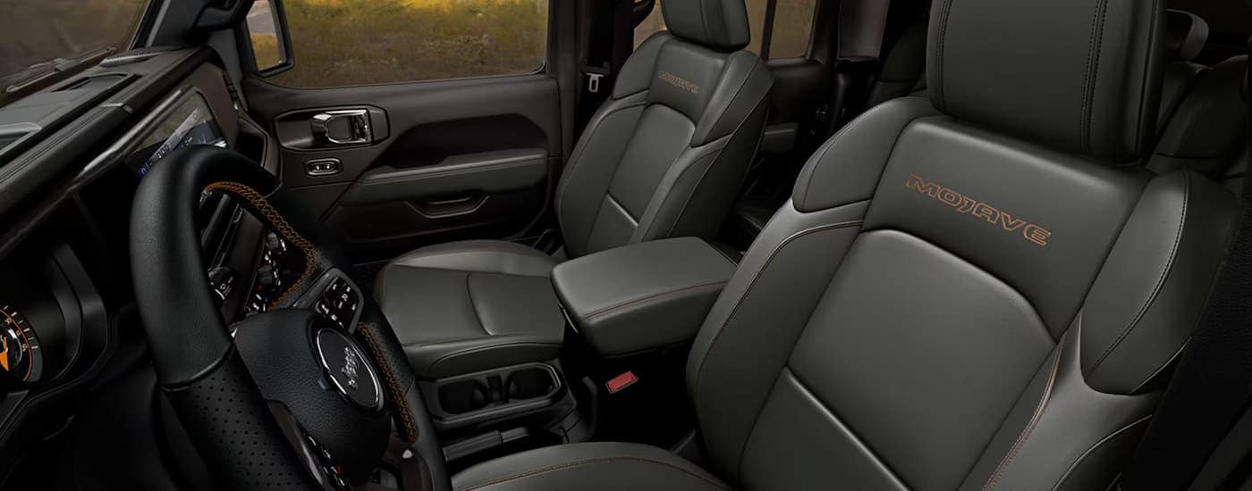 Grey front seats and steering wheel in a 2026 Jeep Gladiator
