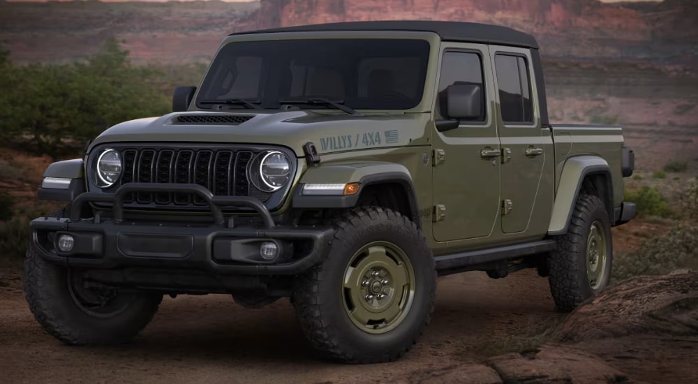 A green 2026 Jeep Gladiator Willys '41 parked off-road 