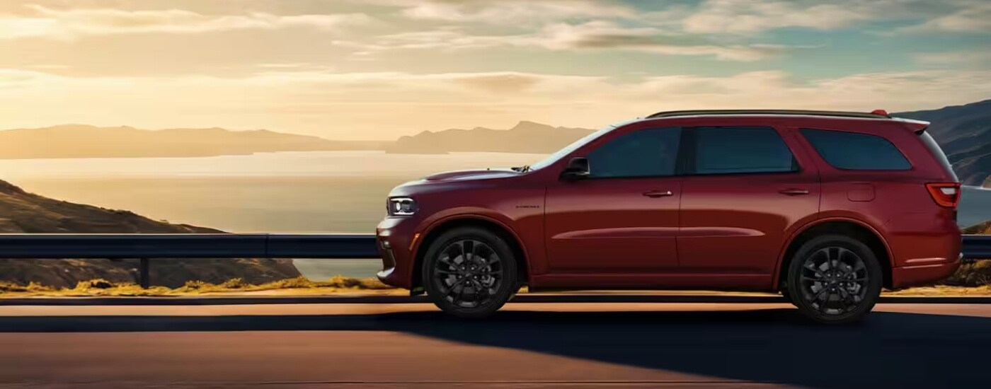 A red 2025 Dodge Durango driving to a Dodge dealer in Miami.