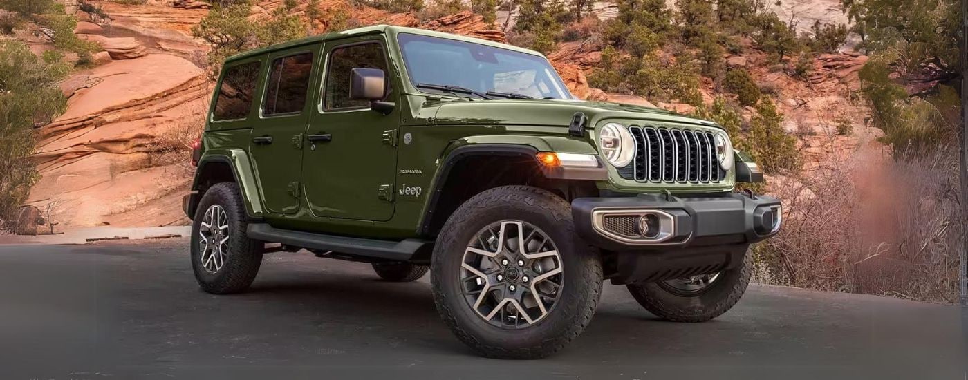 Green 2024 Jeep Wrangler parked at an angle