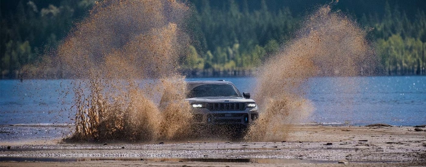 A grey 2025 Jeep Grand Cherokee for sale near Hialeah from the front.