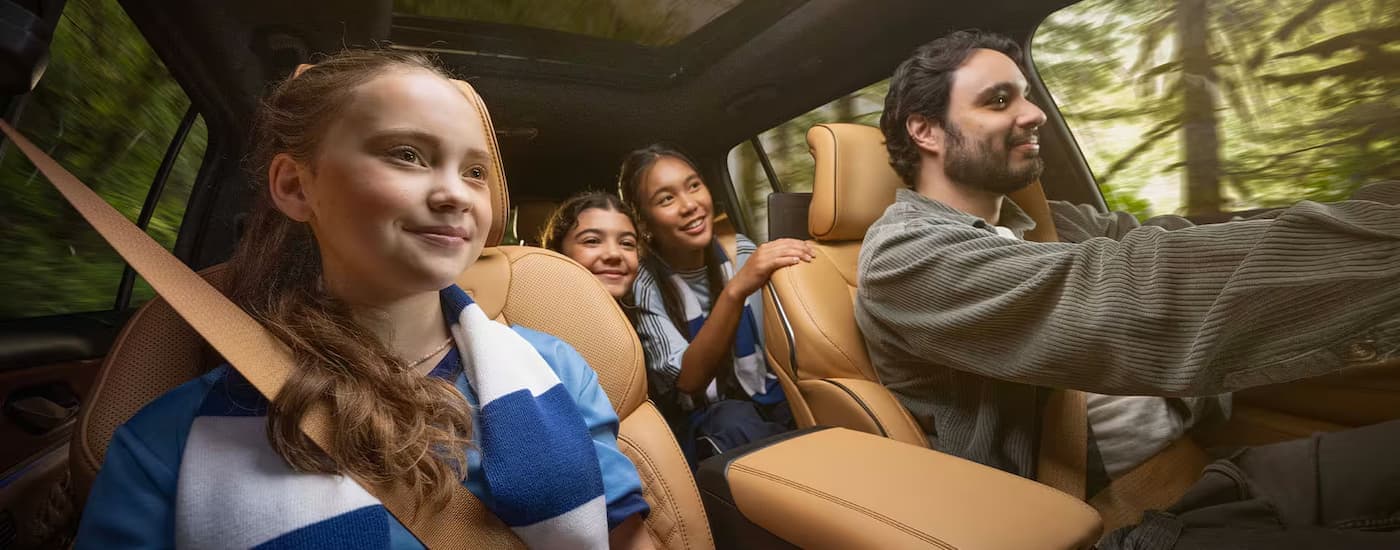 Family driving in a 2025 Jeep Grand Cherokee