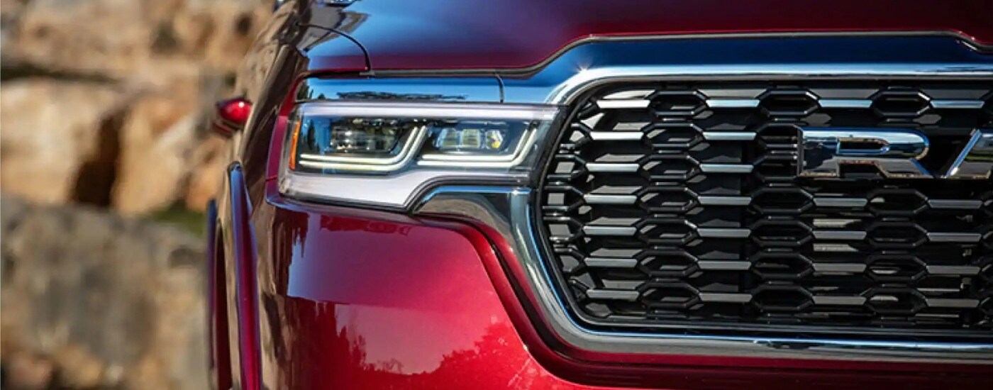 Passenger side headlight on a red 2025 Ram 1500.