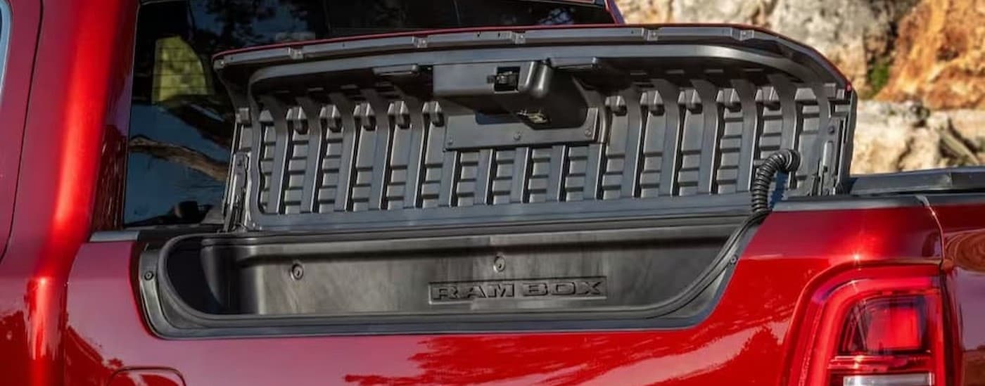 Close-up of Rambox storage on a red 2026 Ram 1500.