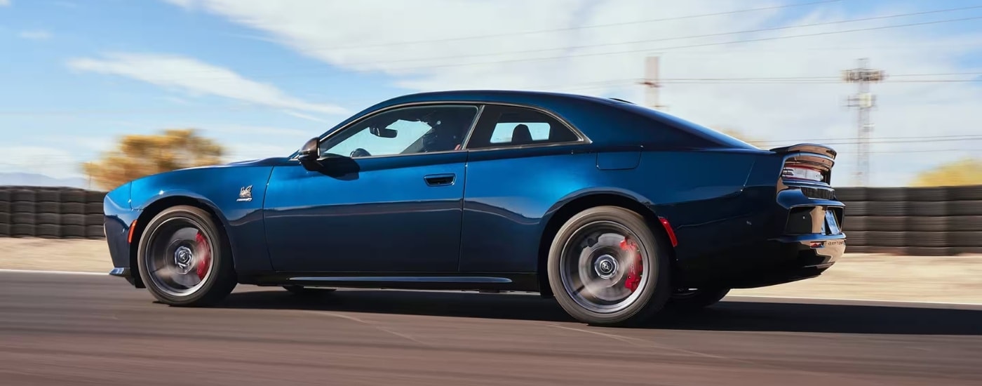 A blue 2025 Dodge Charger Daytona for sale near Hialeah from the side.