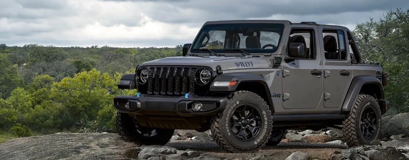 A grey 2025 Jeep Wrangler for sale near Hialeah parked off-road.