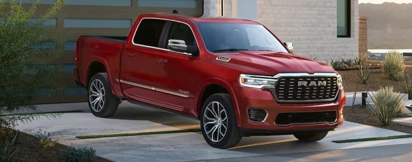 A red 2026 Ram 1500 parked on a driveway.