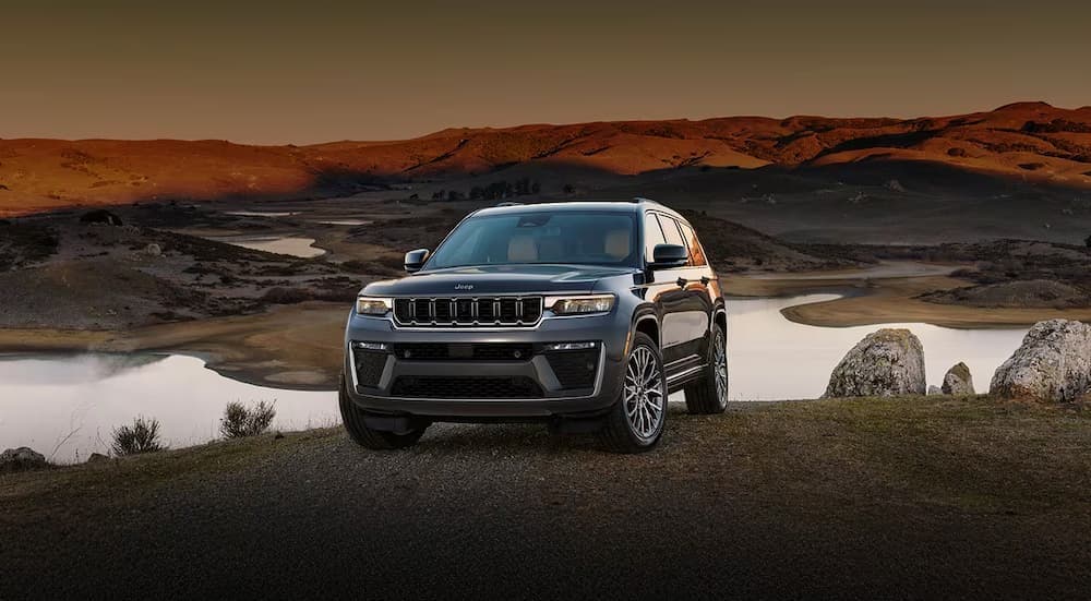 A black 2026 Jeep Grand Cherokee off-road.