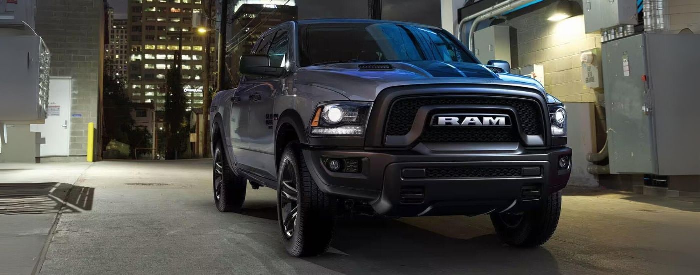 A black 2023 Ram 1500 Classic parked in a city