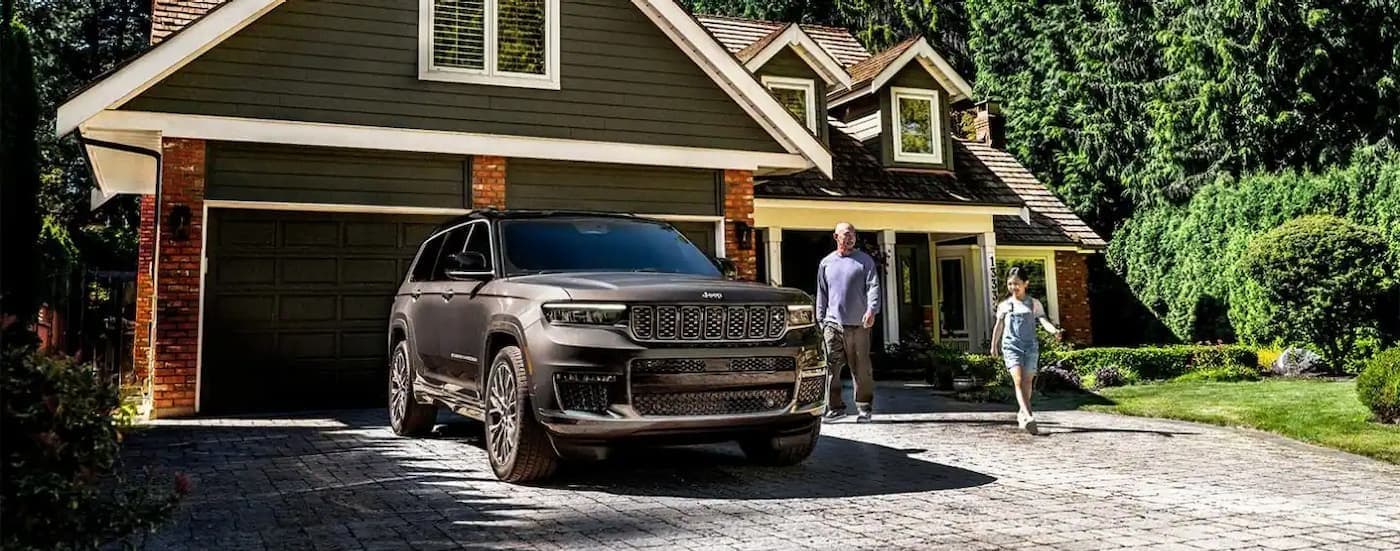 A parked gray 2025 Jeep Grand Cherokee for sale ear Key Biscayne.