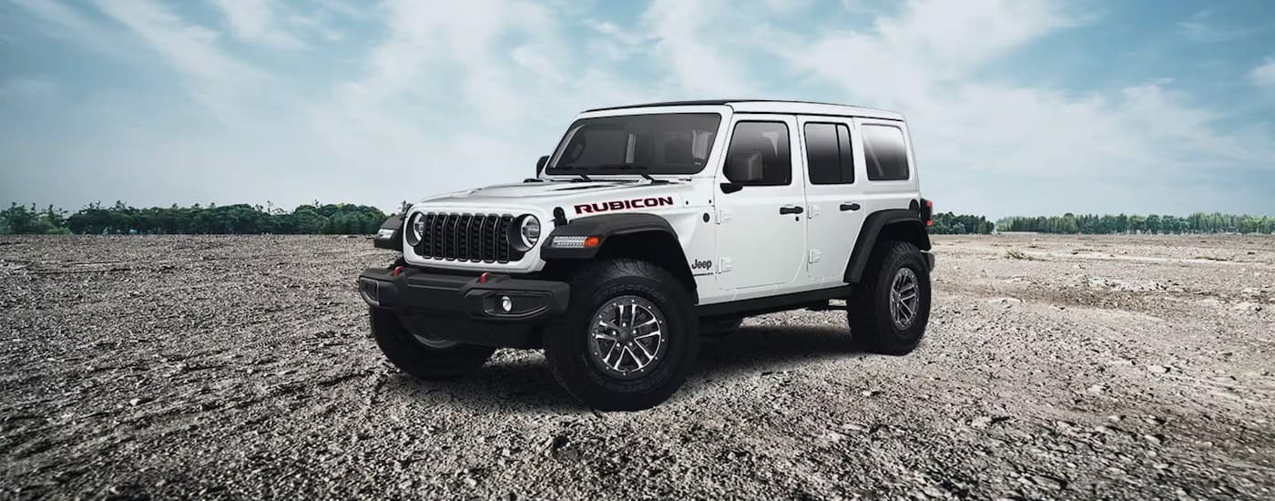 White 2025 Jeep Wrangler Rubicon for sale near Key Biscayne parked off-road.