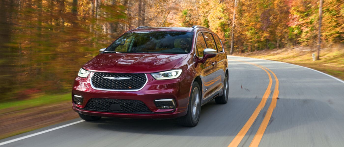 2025 Chrysler Pacifica driving on autumn road