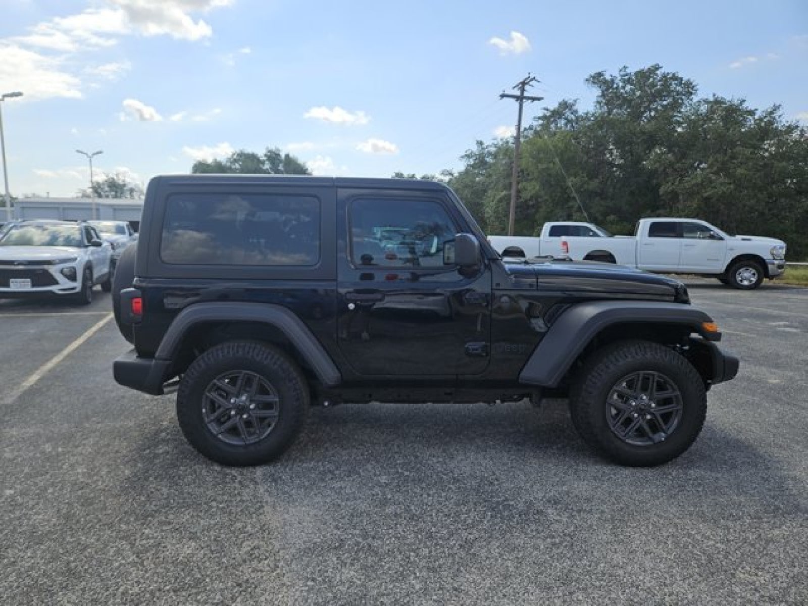 Used 2024 Jeep Wrangler 2-Door Sport S with VIN 1C4PJXAG2RW275699 for sale in Devine, TX