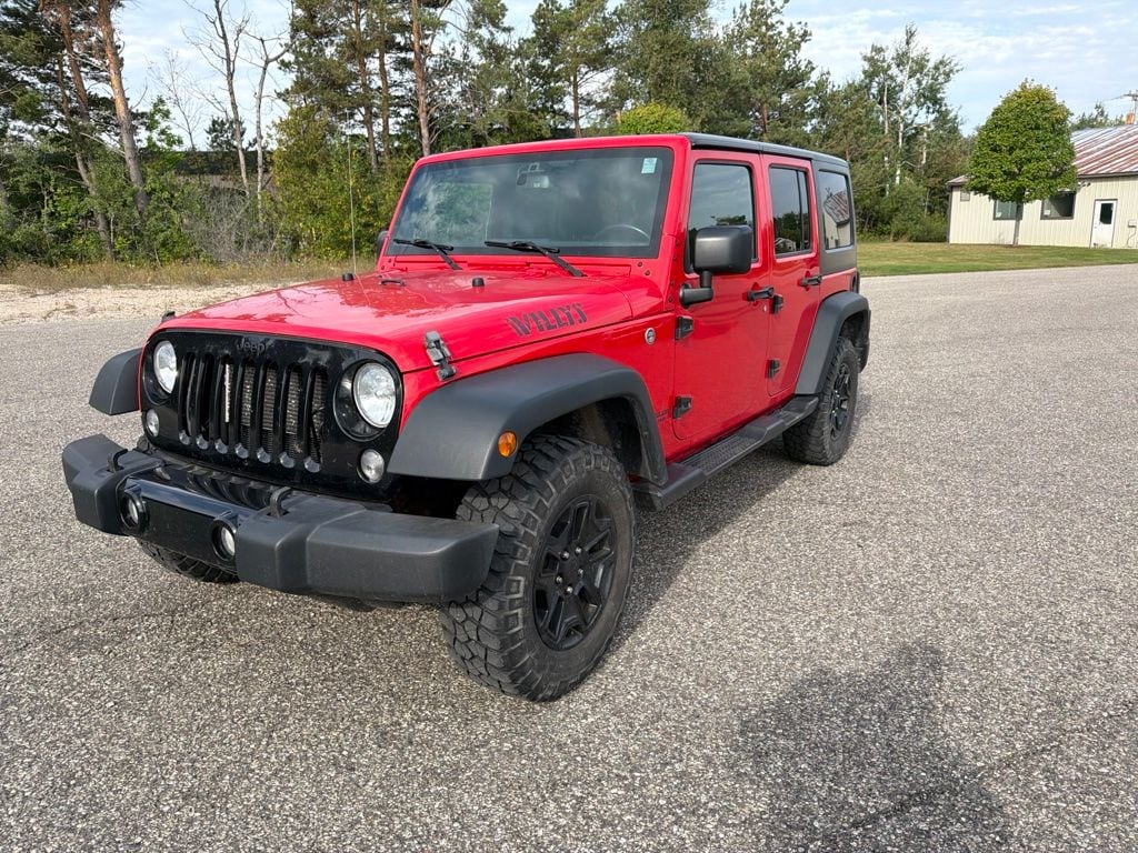 Used 2016 Jeep Wrangler Unlimited Sport with VIN 1C4BJWDG1GL110967 for sale in Petoskey, MI