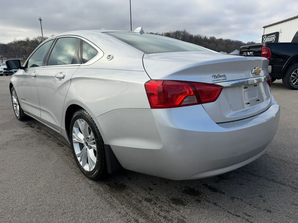 Used 2014 Chevrolet Impala 1LT with VIN 2G1115SL5E9205972 for sale in Elkader, IA