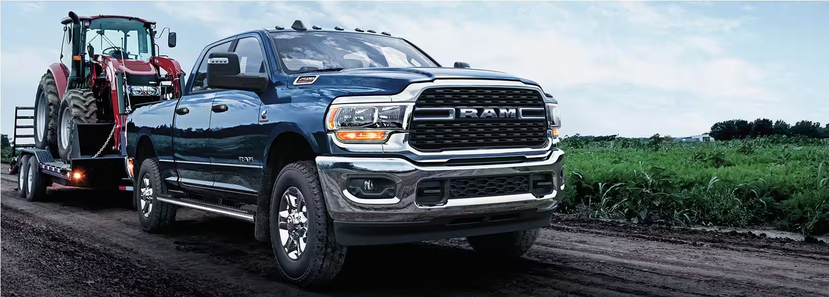 2024 RAM 2500 towing a tractor.png