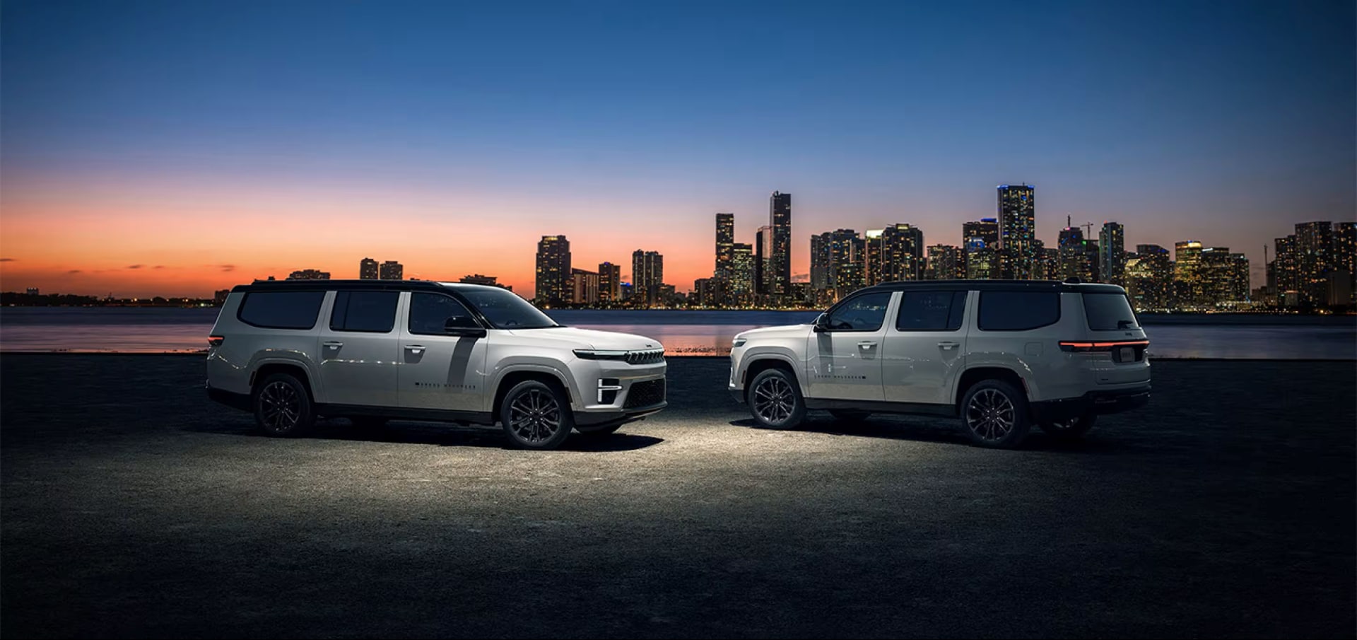 2026-jeep-grand-wagoneer-two-parked-in-city-at-night.png