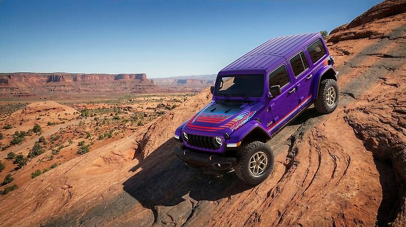 The 2026 Jeep Wrangler traversing mountainous terrain
