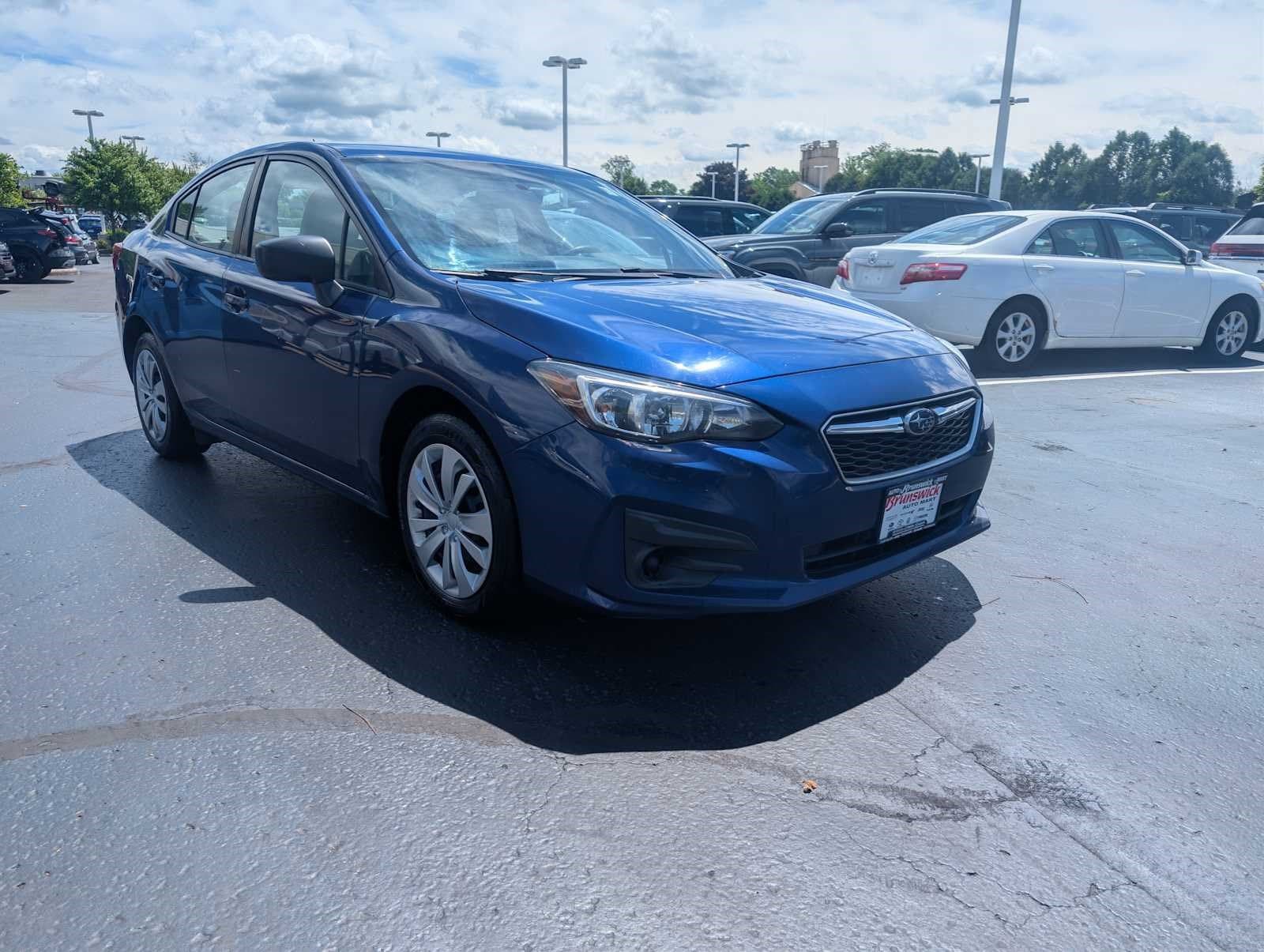 Lapis Blue Pearl 2017 Subaru Impreza Sedan  5-Speed Manual