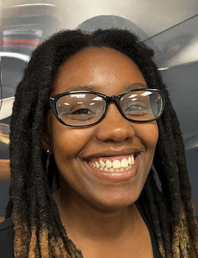 Staff member Angelica Fisher from ca80282c7e9b