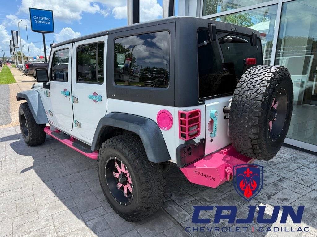 Used 2015 Jeep Wrangler Unlimited Rubicon with VIN 1C4HJWFG8FL530098 for sale in Jennings, LA