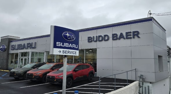  Person cheerfully signing documents.