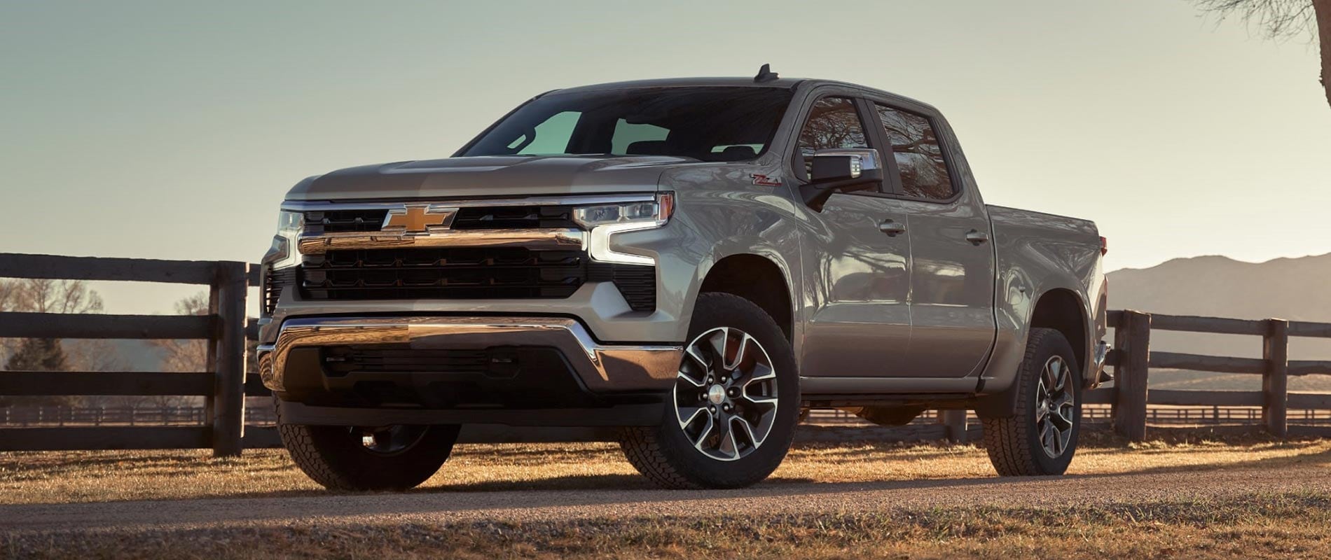 2025 Chevy Silverado parked beside a fence line