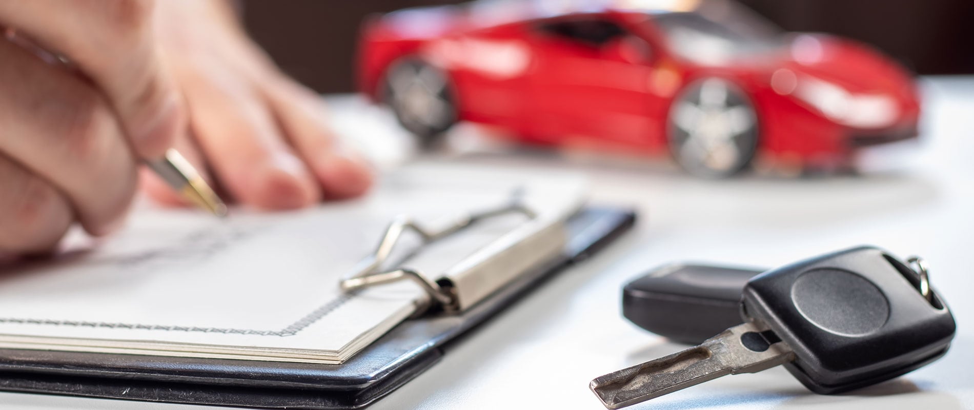 Customer signing financing paperwork for their new Chevy