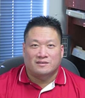 Staff member Dennis Yu from ID_370980