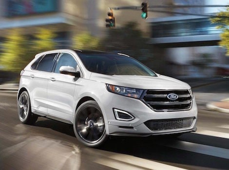 Benefits of Financing A white Ford Car driving down a road