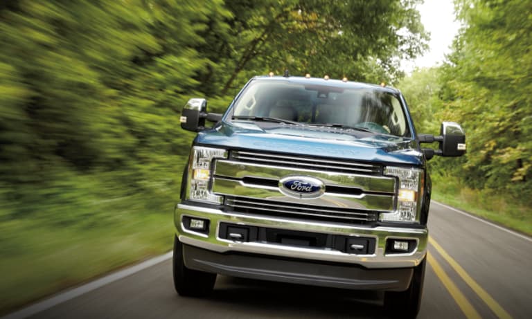 2019 Blue Ford Super Duty Truck Driving