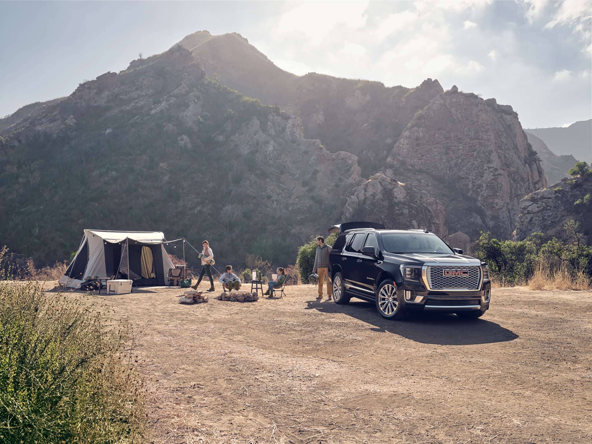 Camping scene with GMC Yukon