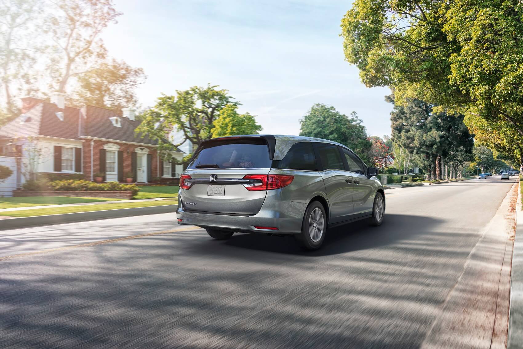 Honda Odyssey Driving in Neighborhood