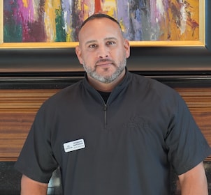 Staff member Anthony Santiago from 4175ae856748